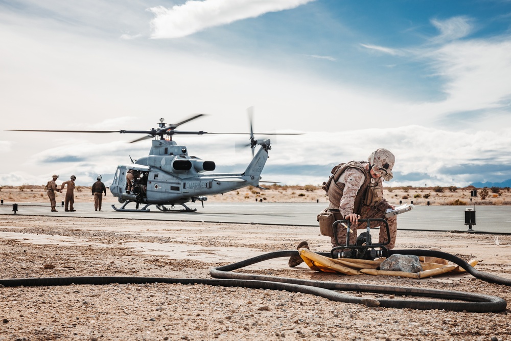 HMLA-267 Marines conduct maintenance on light attack helicopters during SLTE 2-24