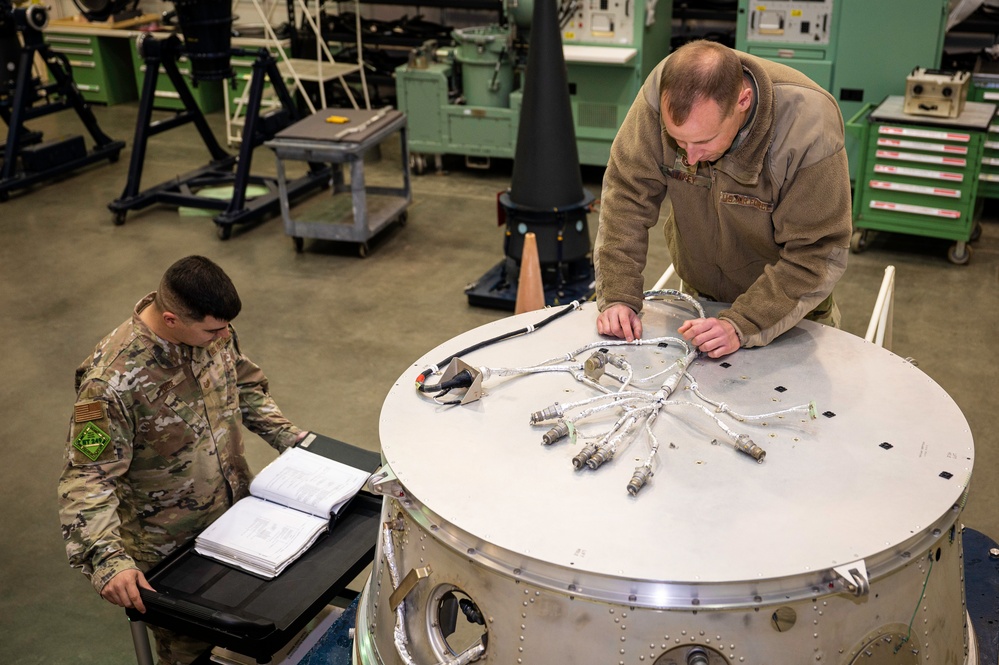 377 FTMMXS technicians work on Training Payload Support Bulkhead