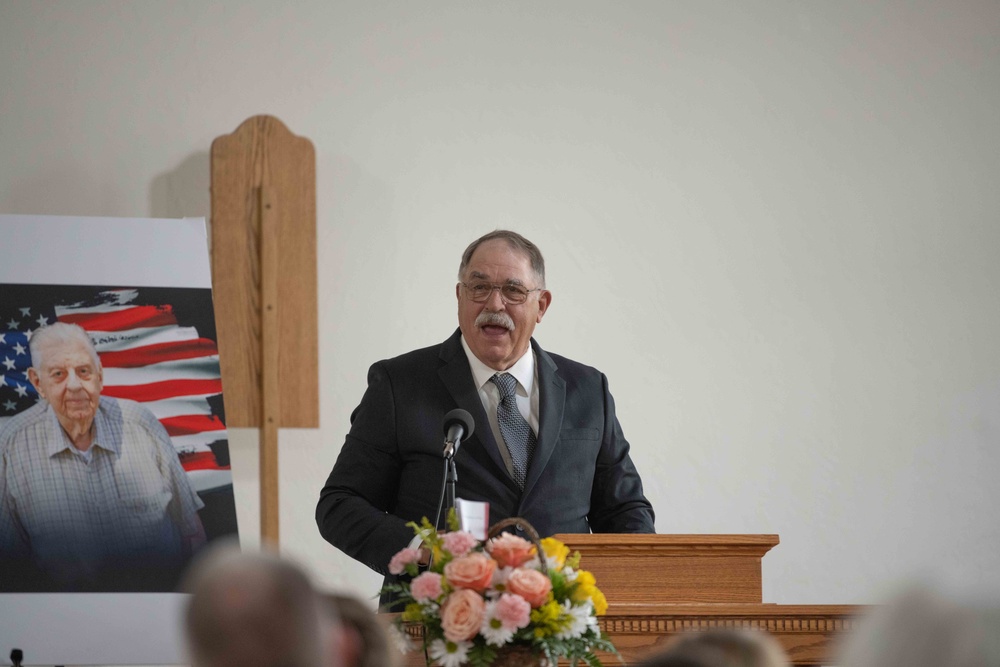 Jeff Dittmer, son of Robert Dittmer, delivers the eulogy at his father’s funeral.