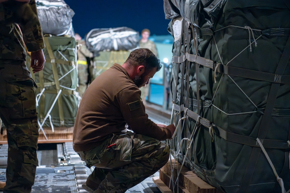 Airmen, Soldiers load AFCENT C-130s with humanitarian aid bound for Gaza