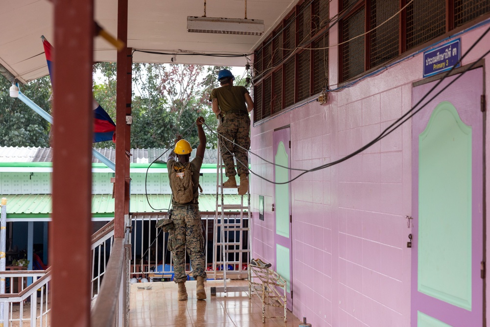 Cobra Gold 24; Marines with Marine Wing Support Squadron 171 work on electrical wiring and concrete prep