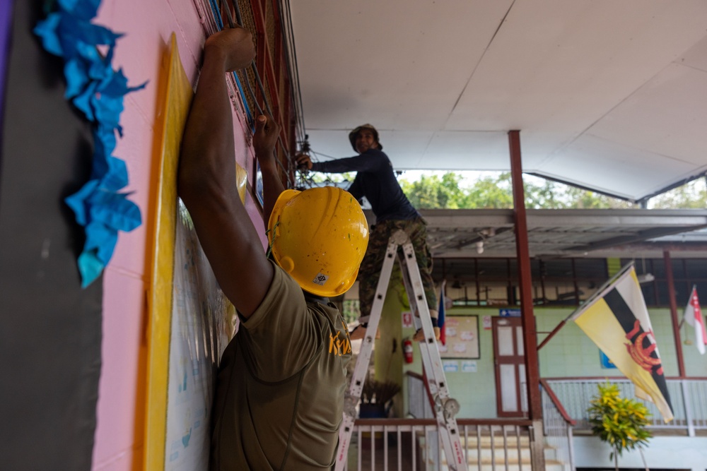 Cobra Gold 24; Marines with Marine Wing Support Squadron 171 work on electrical wiring and concrete prep