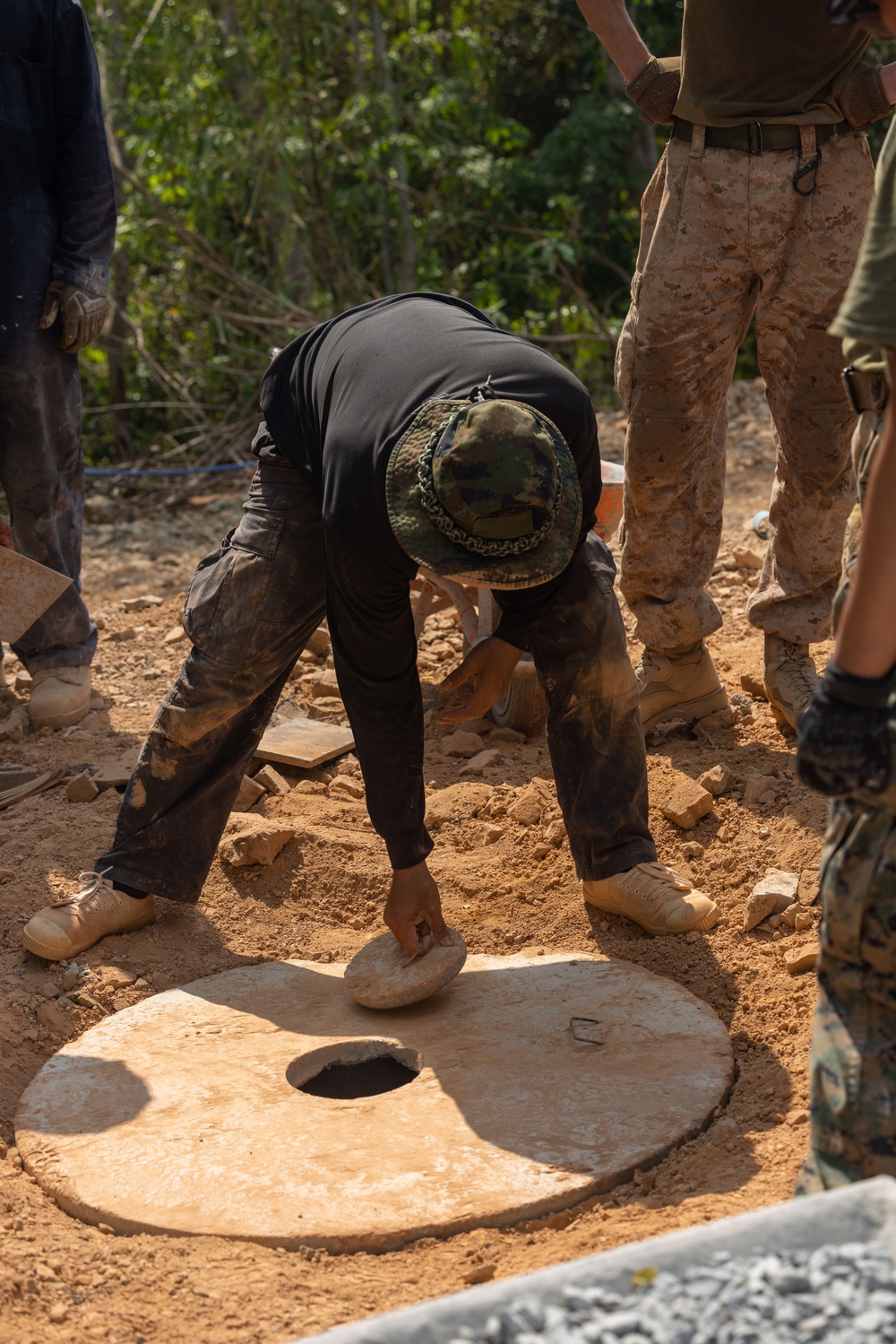 Cobra Gold 24; Marines with Marine Wing Support Squadron 171 work on electrical wiring and concrete prep