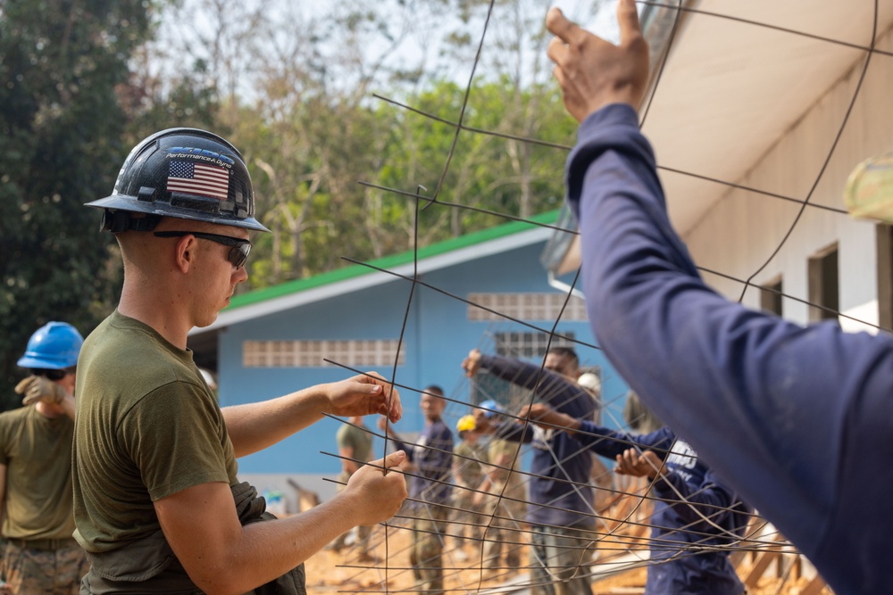 Cobra Gold 24; Marines with Marine Wing Support Squadron 171 work on electrical wiring and concrete prep