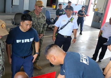 Rear Adm. Barnett meets with Navy Federal Fire Department firefighters