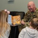 436th AW commander, command chief lead story time at the USO