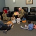 436th AW commander, command chief lead story time at the USO