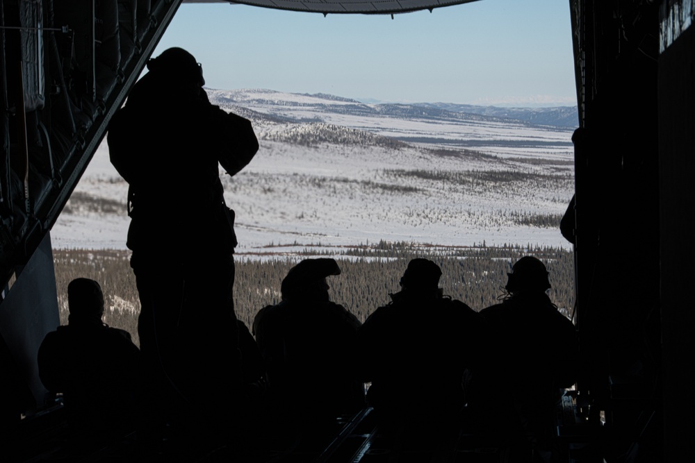 ARCTIC EDGE 24: Joint Service Members sit on back of MC-130J ramp