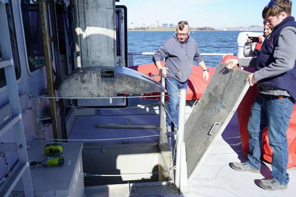 The crew of the US Army Corps of Engineers aboard the survey boat &quot;Catlett&quot; prepares to deploy the multibeam sonar.