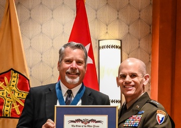 MWR director earns high honor, inducted into Order of the White Plume