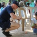 USS Manchester (LCS 14), Philippine Navy Sailors visit Agusuhin Elementary School in Subic Bay