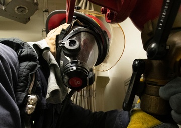 U.S. Navy Sailor engages in In-port Emergency Fire Drill aboard USS Gerald R. Ford