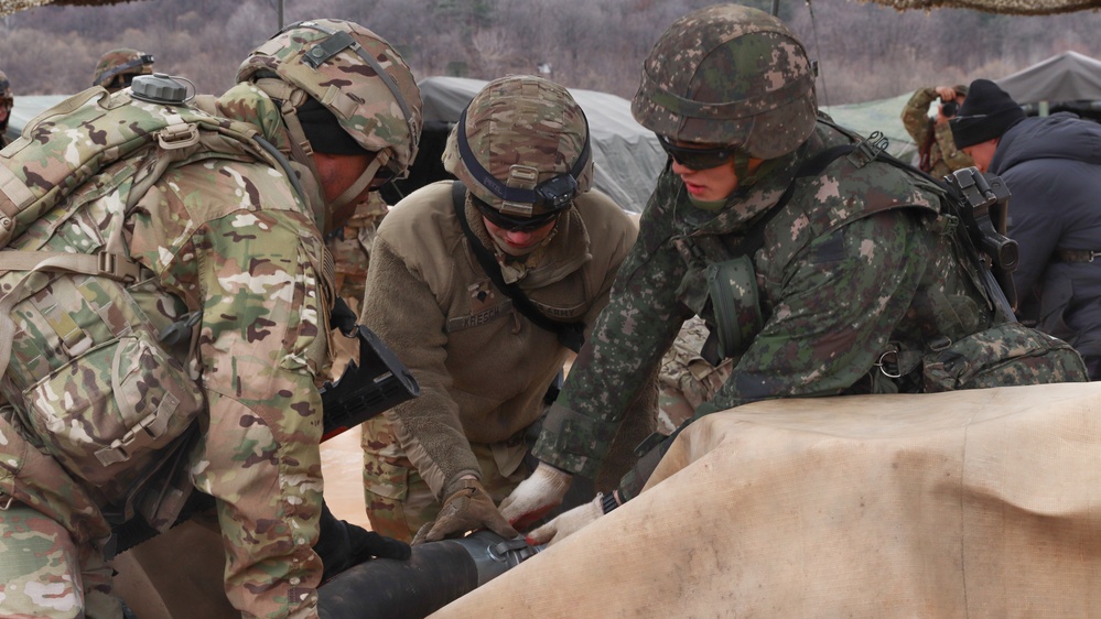 U.S. Soldiers and ROK soldiers attach fuel transfer lines, Freedom Shield 24