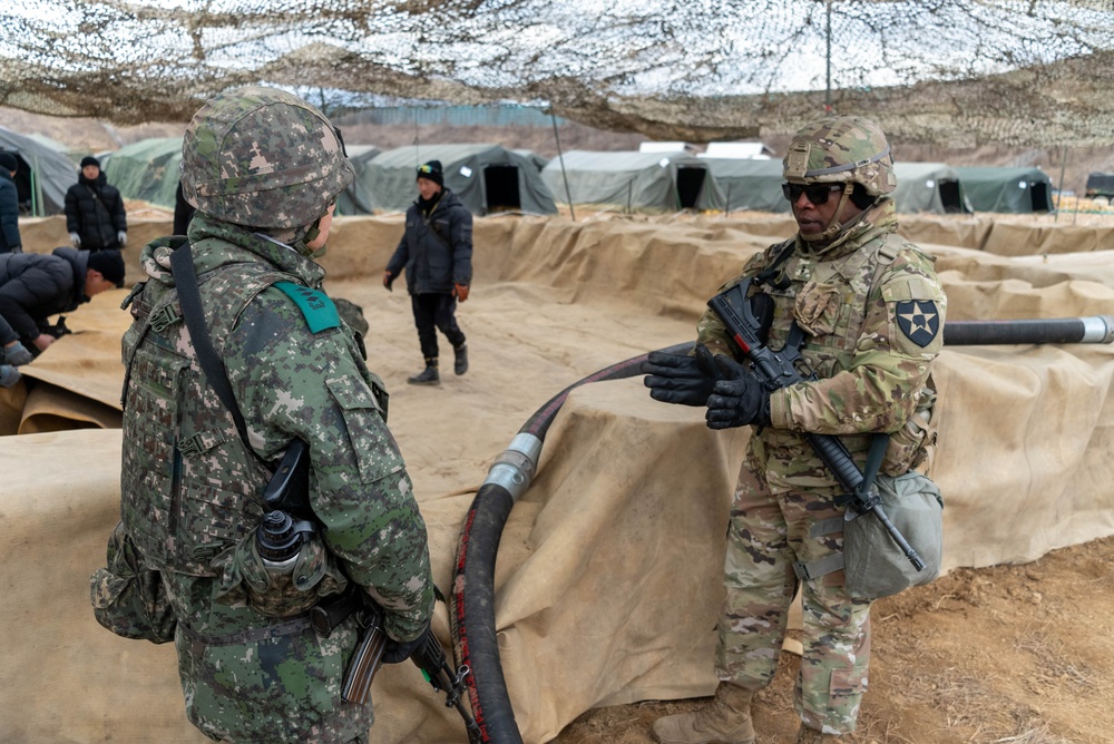 U.S. Soldier and ROK soldier discuss equipment interoperability, Freedom Shield 24