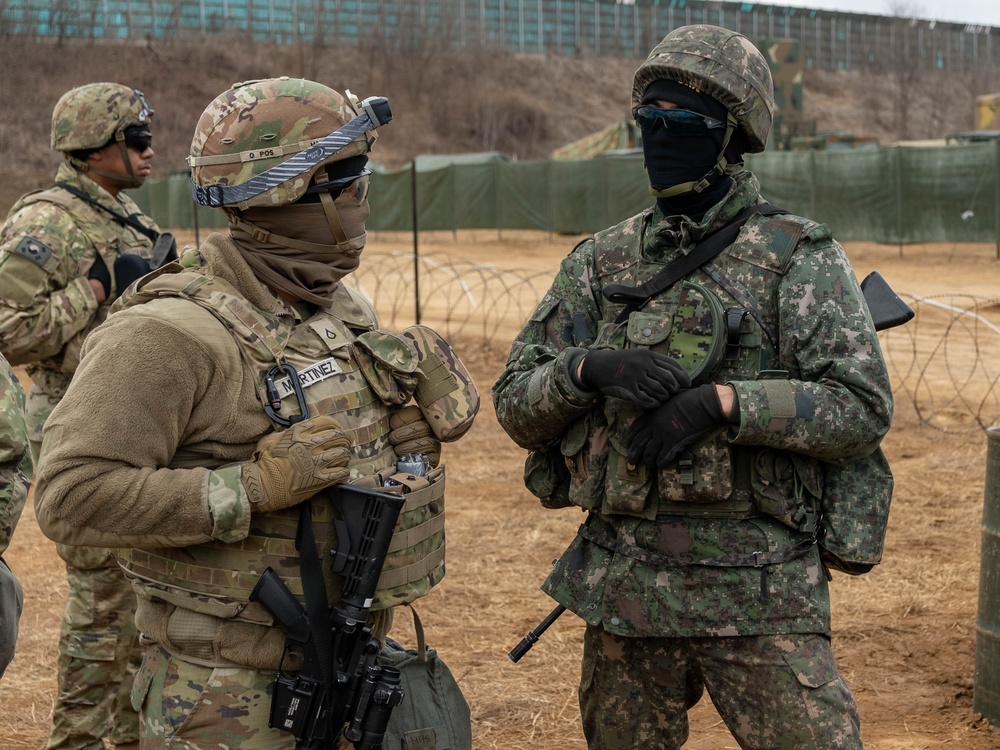 U.S. Soldier and ROK soldier discuss training plans as part of Freedom Shield 24