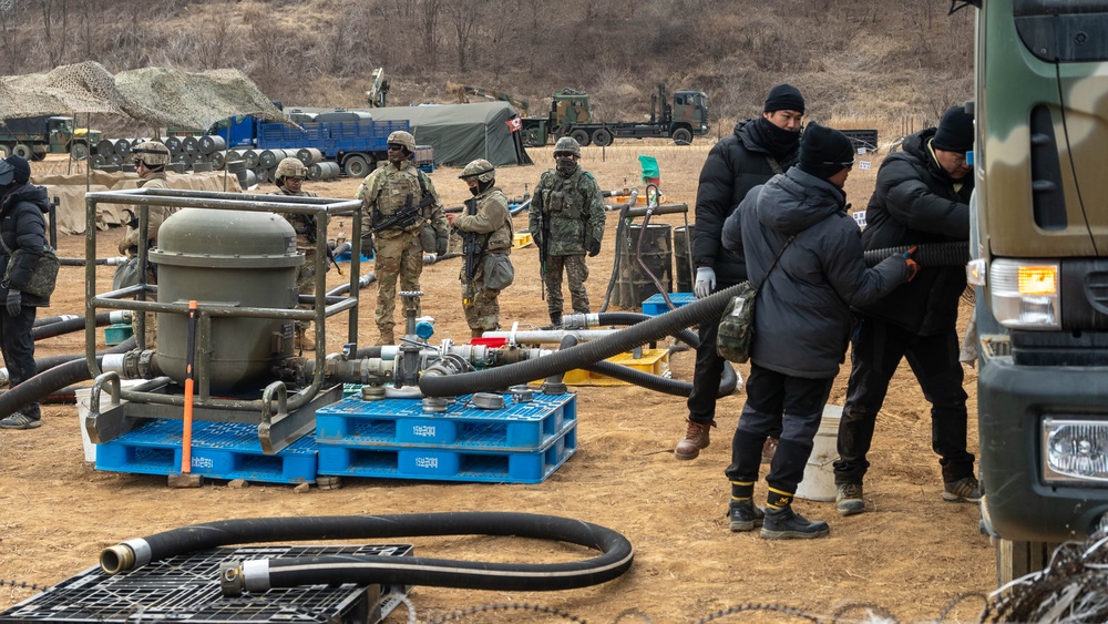 U.S. Soldiers and ROK soldiers interconnect fuel transfer equipment as part of Freedom Shield 24