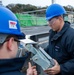 USS Ronald Reagan (CVN 76) Sailors install a repeater panel