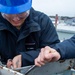 USS Ronald Reagan (CVN 76) Sailors install a repeater panel