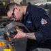 USS Ronald Reagan (CVN 76) Sailors craft a machine part