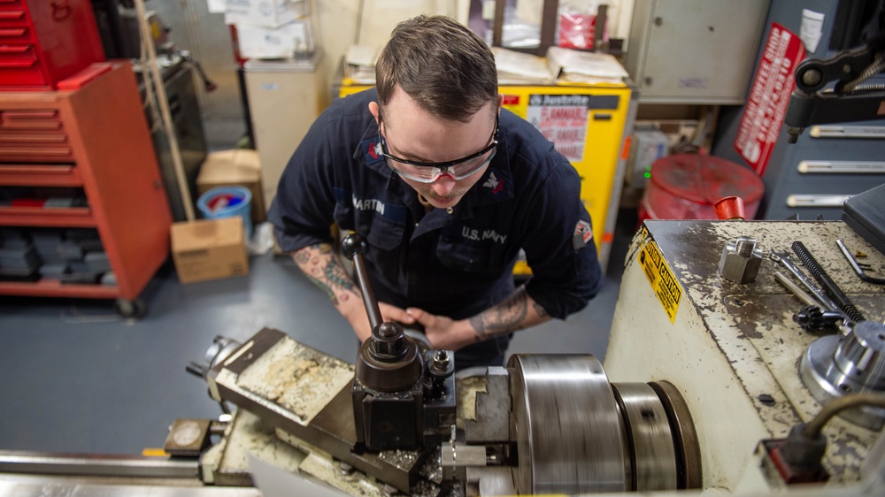 USS Ronald Reagan (CVN 76) Sailors craft a machine part