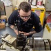 USS Ronald Reagan (CVN 76) Sailors craft a machine part