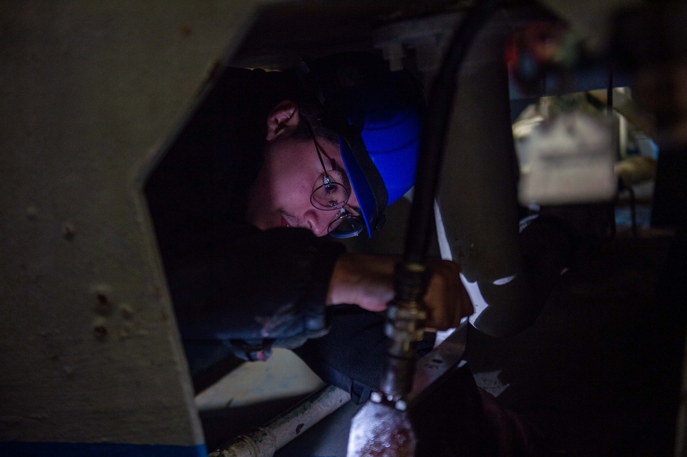 USS Ronald Reagan (CVN 76) Sailors perform repairs and maintenance