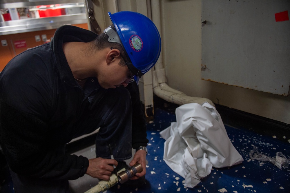 USS Ronald Reagan (CVN 76) Sailors perform repairs and maintenance