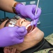 USS Ronald Reagan (CVN 76) Sailors conduct a dental examination