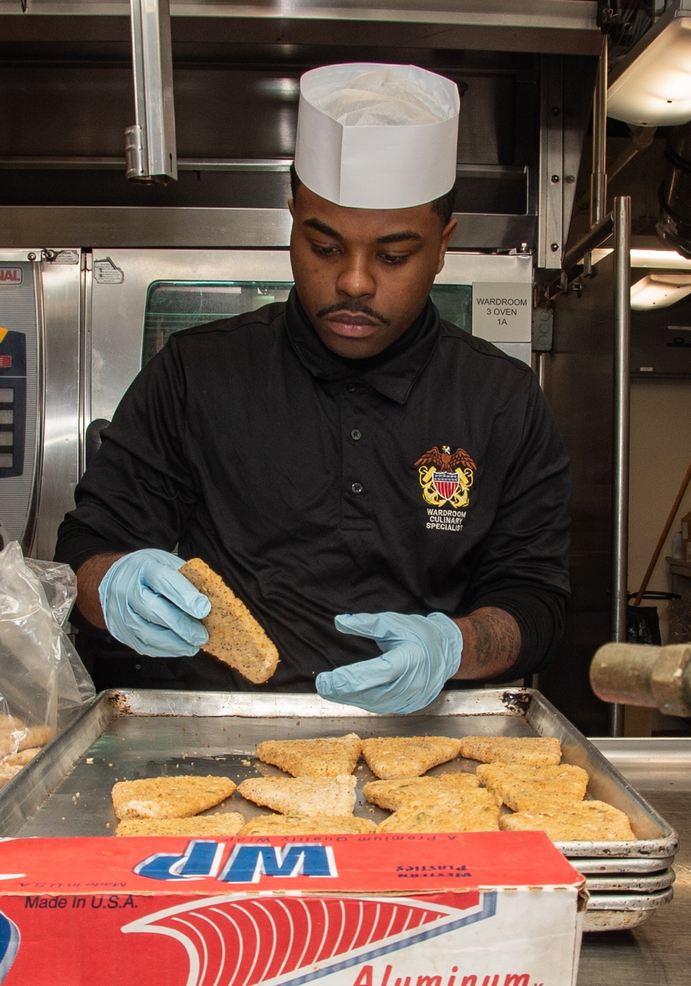 USS Ronald Reagan (CVN 76) Sailors prepare food in wardroom galley