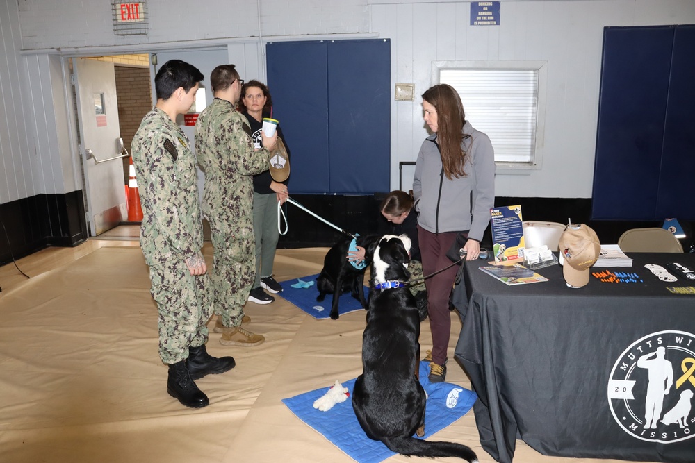 U.S. Sailors visit the Mutts With A Mission Table
