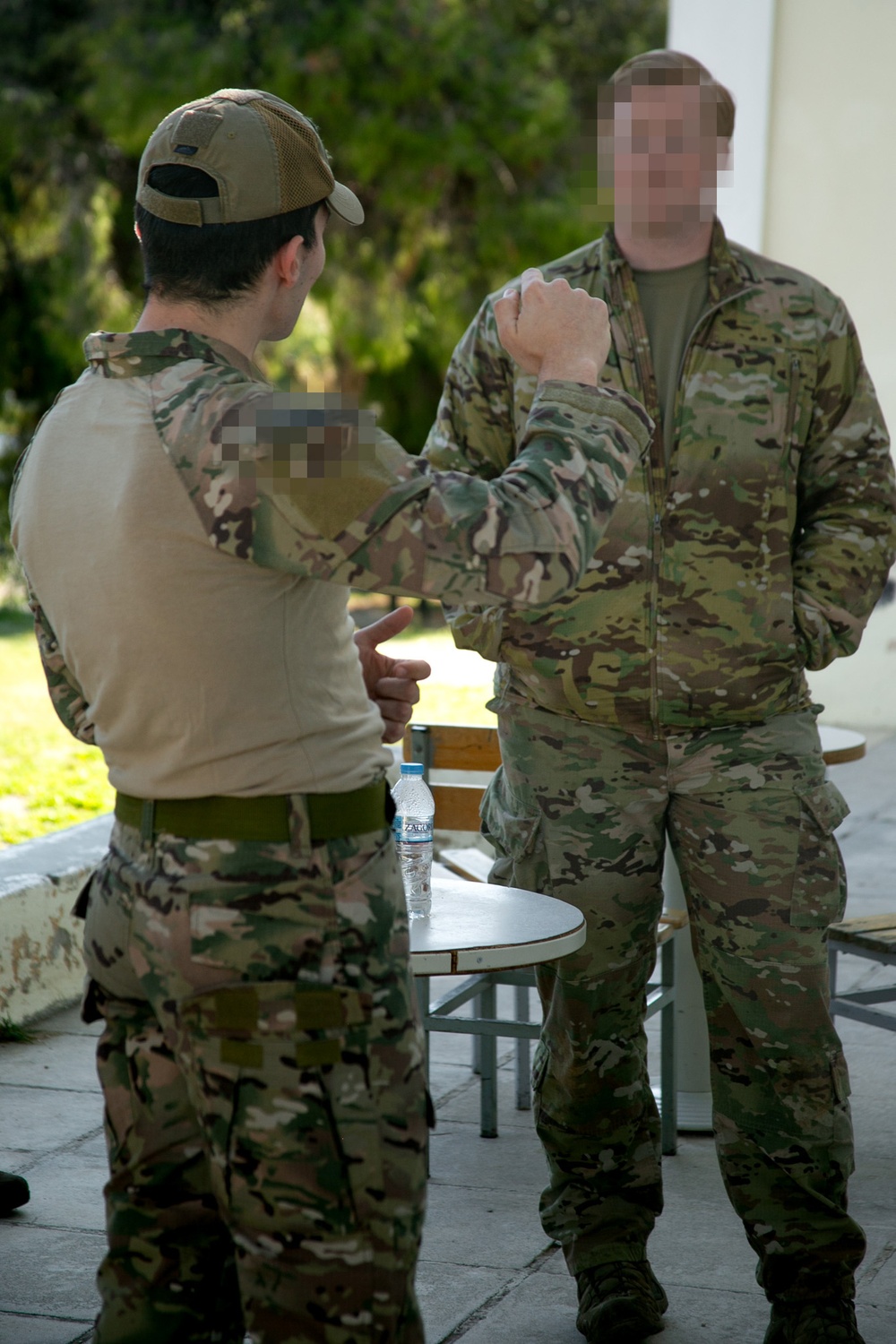 Green Beret and Greek SOF soldier discuss tactics