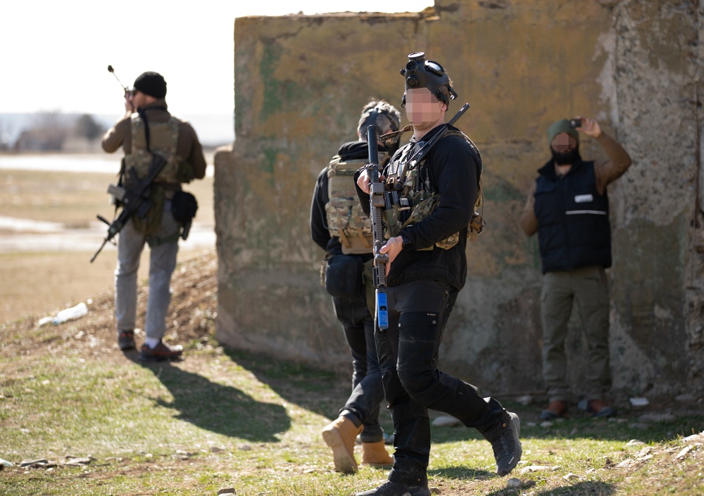 U.S. Green Berets work with Georgian special operations forces to secure a chemical weapons site during Trojan Footprint 24