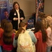 Children gather around a STEM table