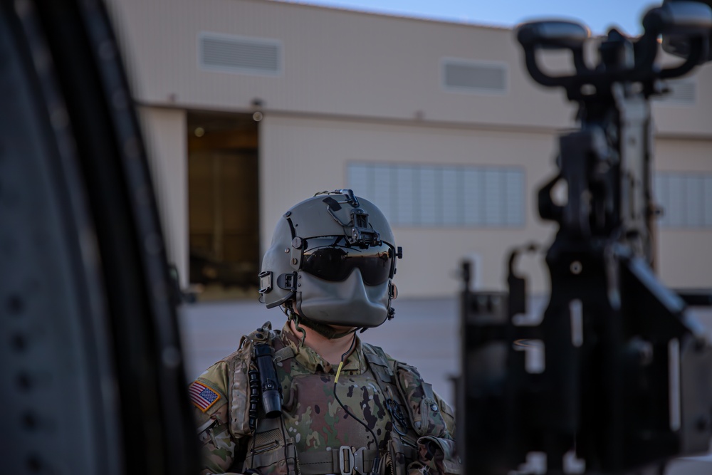 U.S. Army Door Gunner conduct pre-flight checks