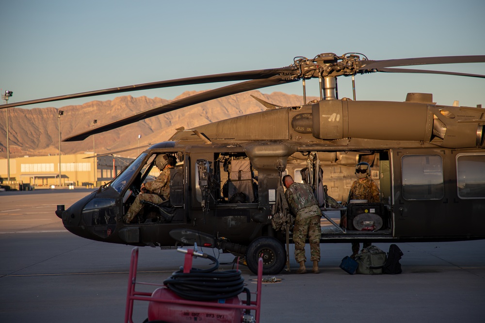 U.S. Army UH-60M Black Hawk crews conducts pre-flight checks