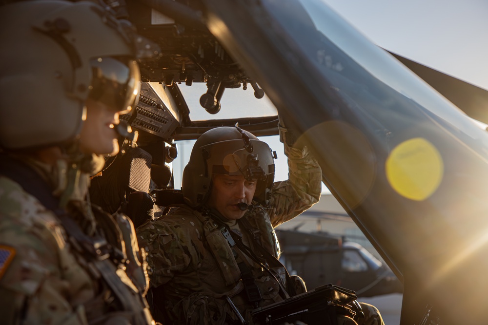 U.S. Army pilots conduct pre-flight checks