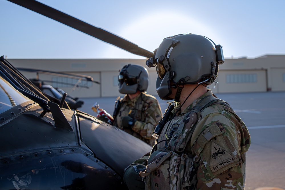 U.S. Army Door Gunners conduct pre-flight checks