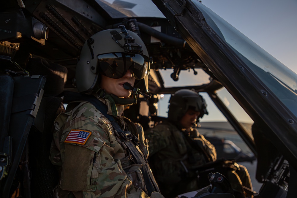 U.S. Army pilots conduct pre-flight checks