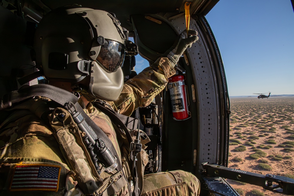 U.S. Army Door Gunner scans the horizon