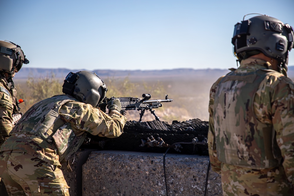 U.S. Army Door Gunner fires a M240H