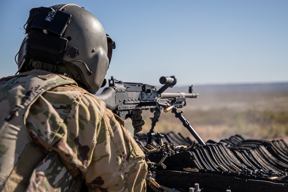 U.S. Army Door Gunner fires a M24