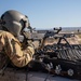 U.S. Army Pilot fires a M240B