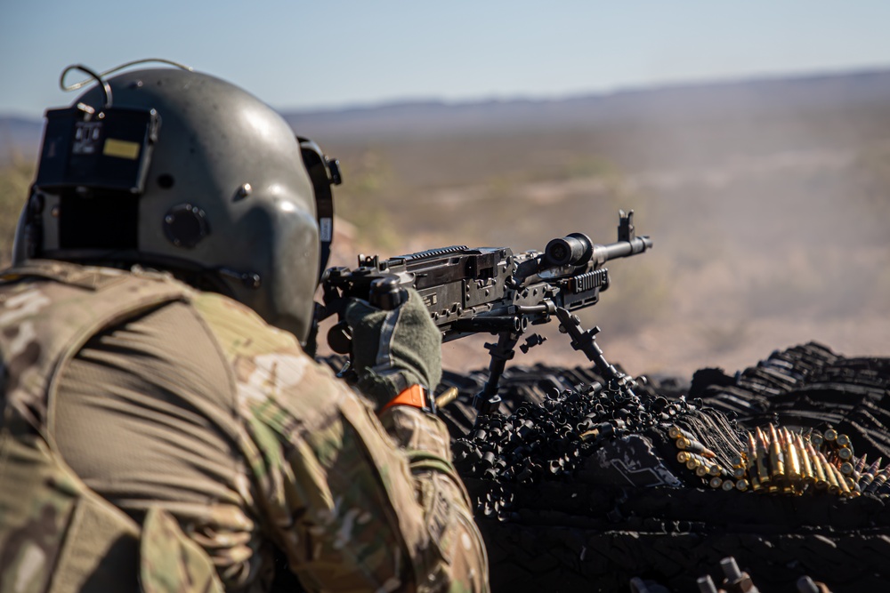 U.S. Army Pilot fires a M240H