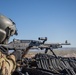 U.S. Army Door Gunner fires a M240B