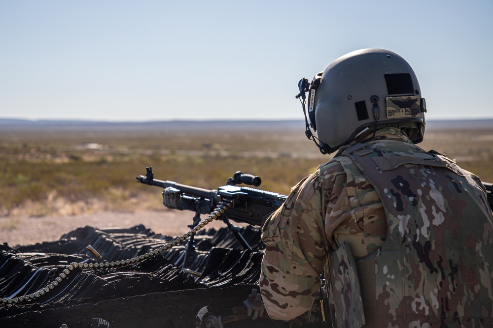 U.S. Army Pilot fires a M240H