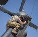 U.S. Army Door Gunner conducts pre-flight checks