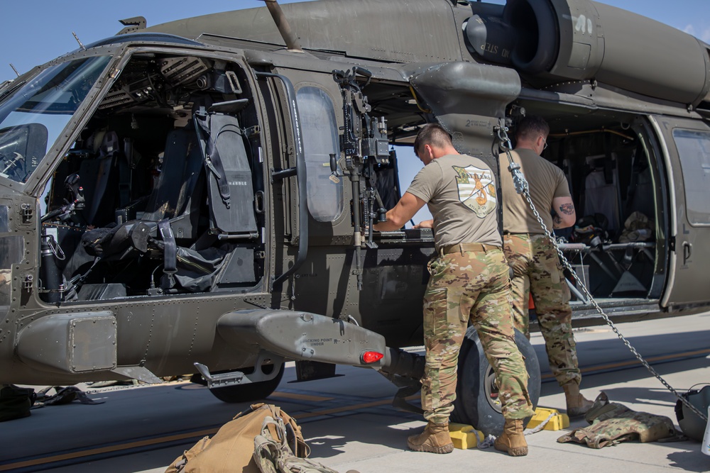 U.S. Army UH-60M Blackhawk crew conduct pre-flight checks