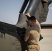 U.S. Army Door Gunner conducts pre-flight checks