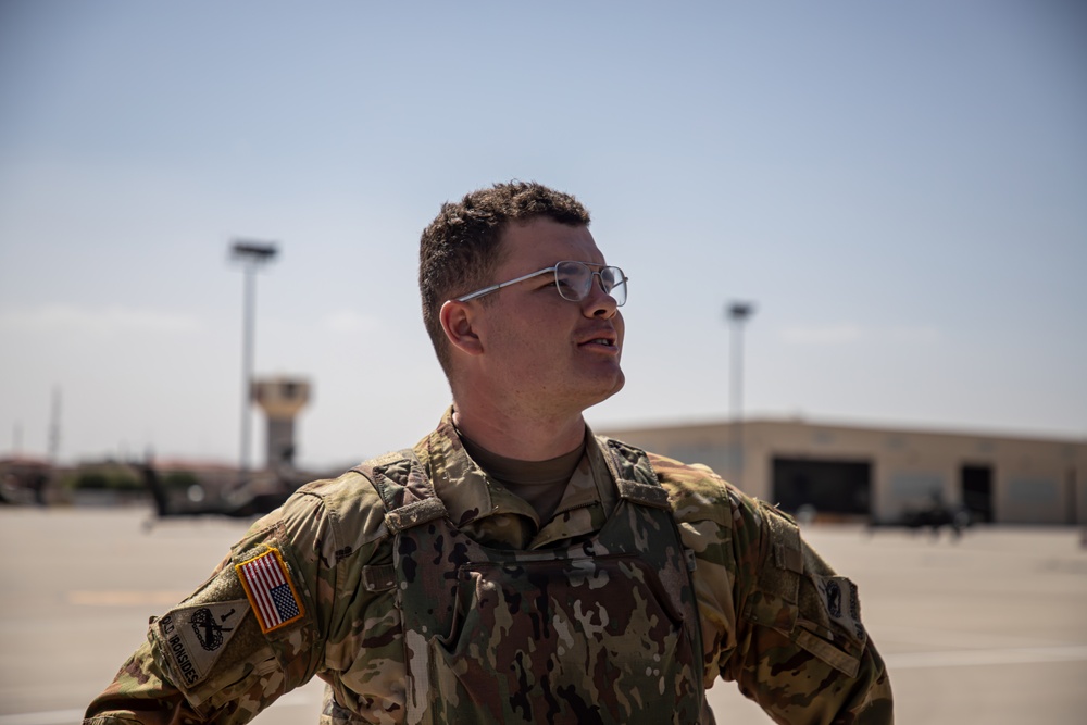 U.S. Army Door Gunner poses for a pictures