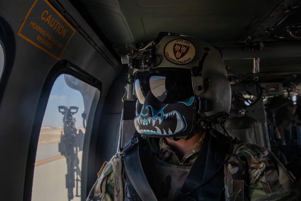 U.S. Army Door Gunner looks off into the distance